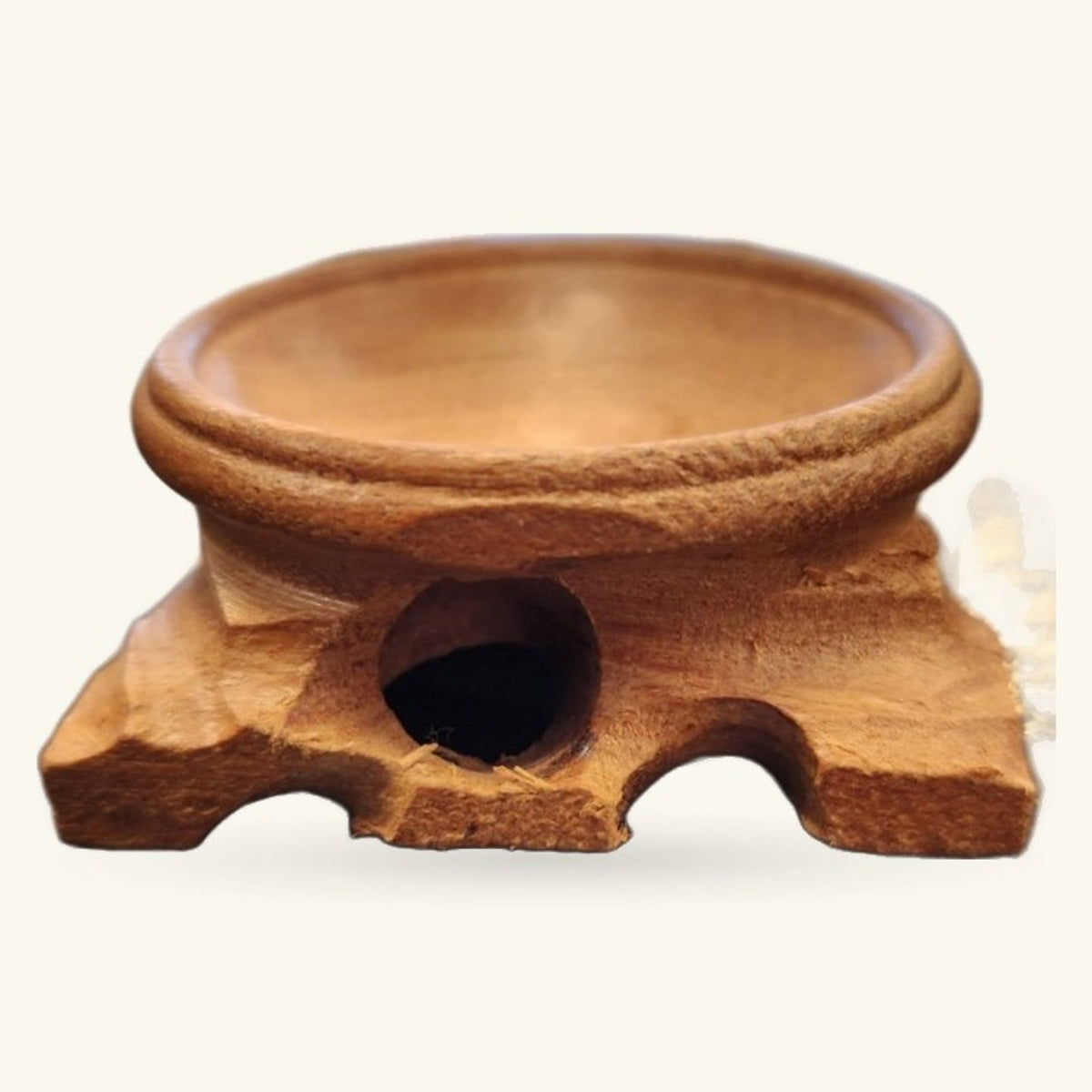 Wooden crystal sphere stand with carved elephant design and circular opening