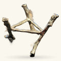 Brass-toned metal tree crystal stand with three branch-like arms holding polished stones