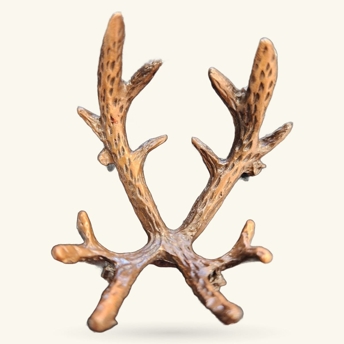Decorative bronze metal spherical stand with branching antler-like design and textured finish