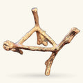 Bronze-toned metal tree-shaped crystal stand with branching arms and decorative details on white background
