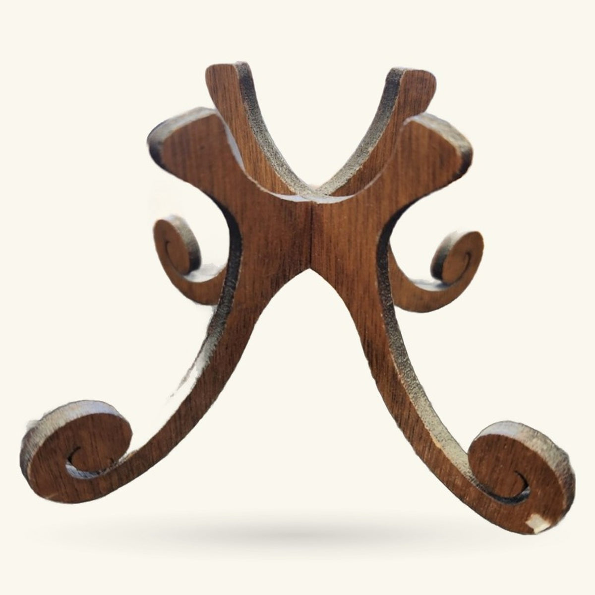 Wooden egg stand with curved arms and circular holders, natural brown finish with decorative scrollwork