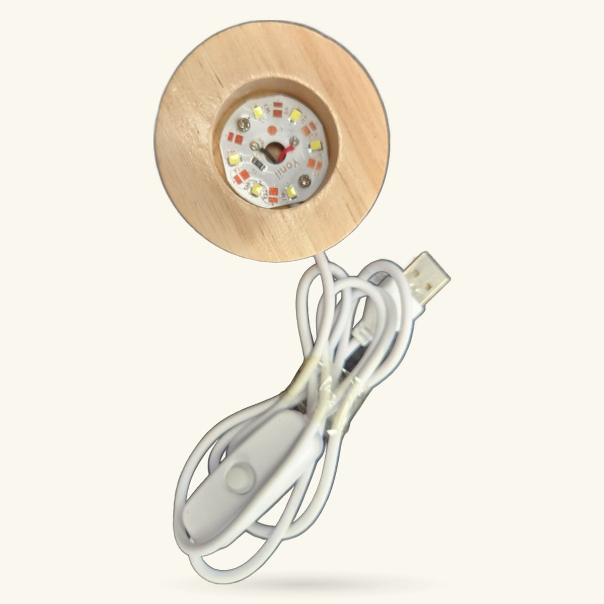 Round wooden light base with warm white LED lights and USB power cord