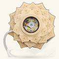 Wooden lotus-shaped warm light fixture with intricate carved detailing and visible LED bulb mechanism