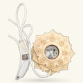 Wooden lotus-shaped USB light with ornate carved details and USB cable attached to white connector.