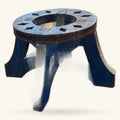 Wooden sphere stand with blue-painted legs and circular carved top with slot openings