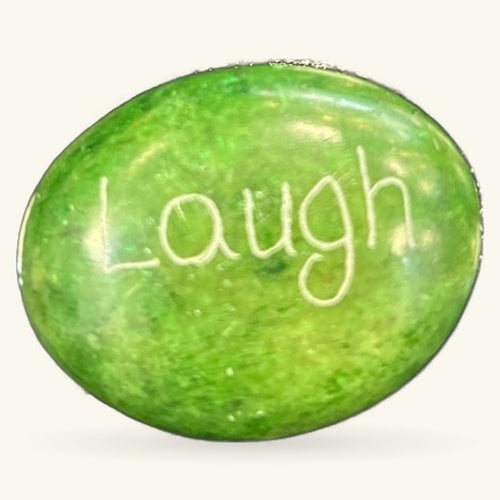 Green inspirational rock with 'Laugh' engraved in white lettering, 3cm size