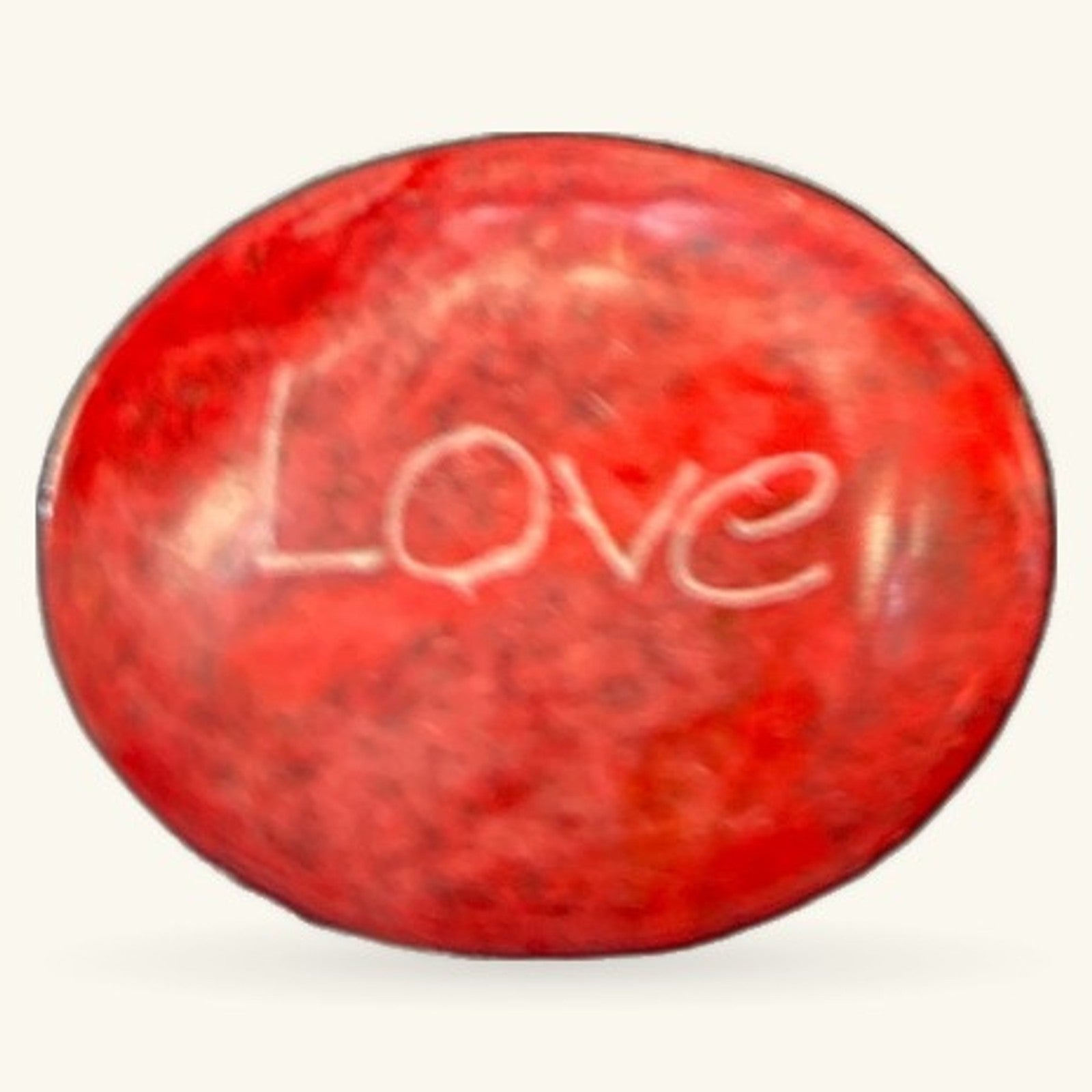 Red polished stone with 'Love' engraved on surface, oval shape, approximately 3cm