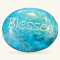 Turquoise polished stone with 'Blessed' engraved on top, smooth oval shape, 3cm size