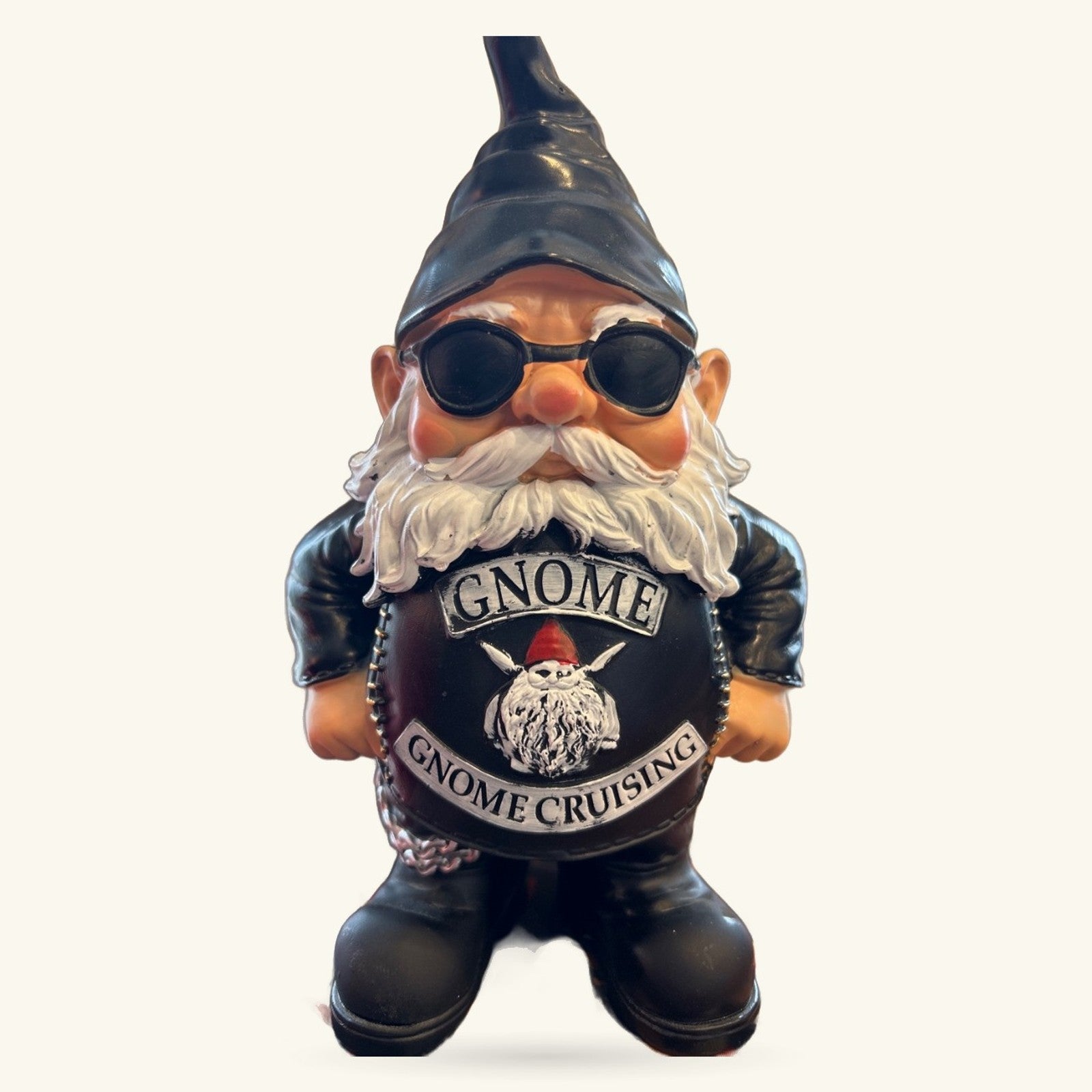 Standing biker gnome figurine wearing sunglasses, pointed hat, white beard, and black leather jacket with 'Gnome Cruising' text