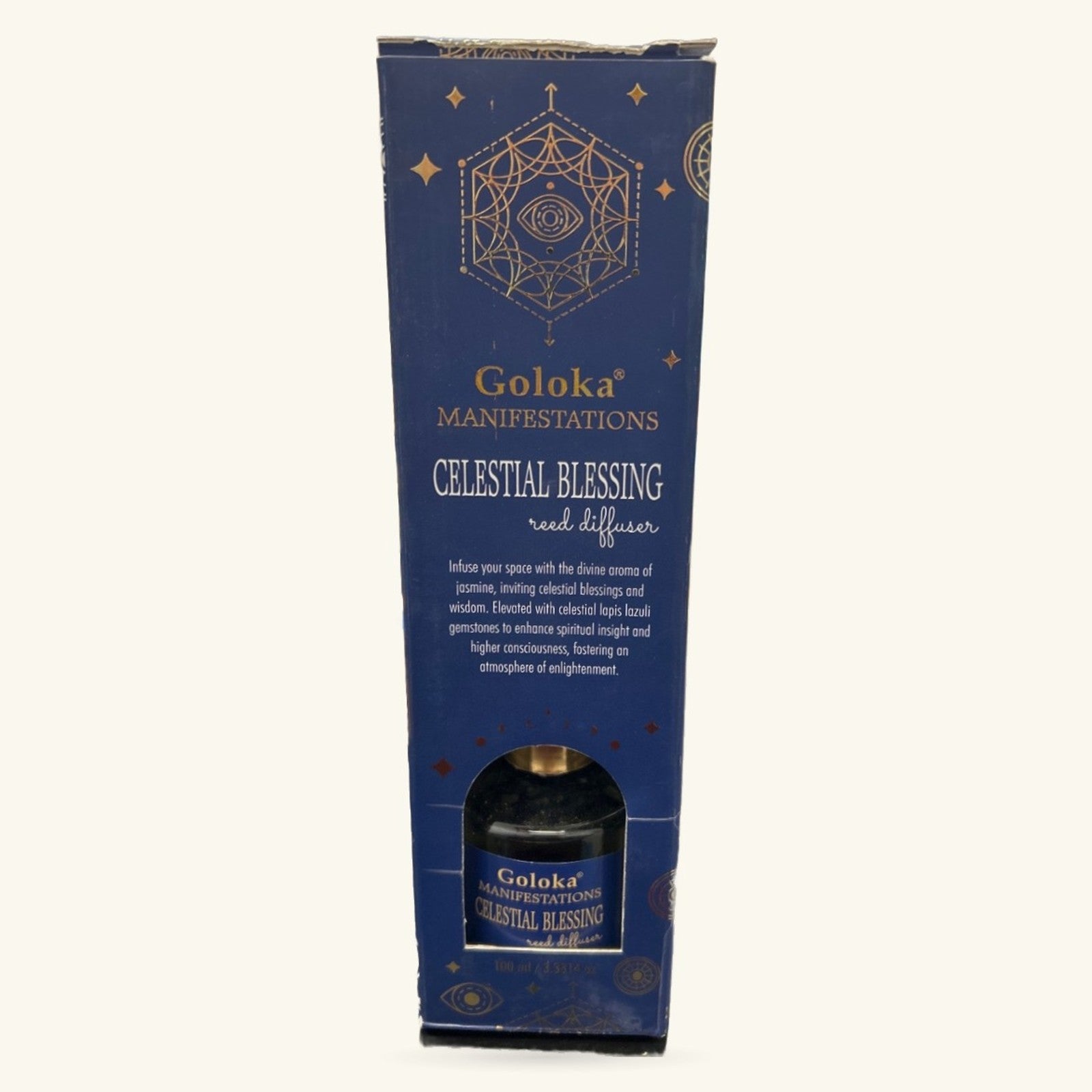 Goloka Manifestations Celestial Blessing reed diffuser in navy blue box with gold geometric design and black bottle