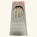 Vampire Tears black taper candles in grey packaging with ornate oval window display