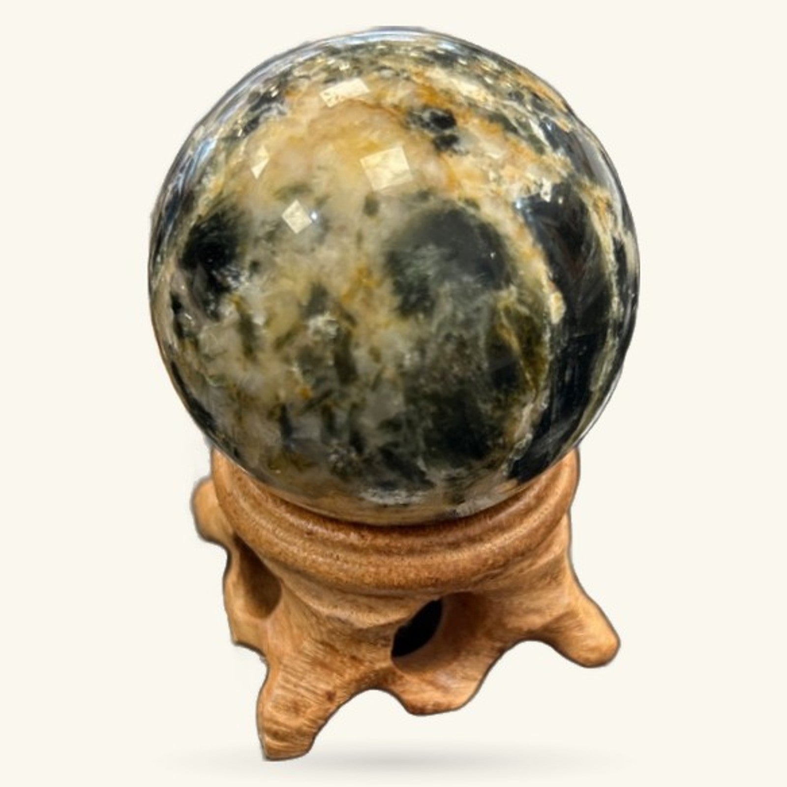 Black Moonstone sphere 4.8cm on wooden stand, cream and black patterned polished stone