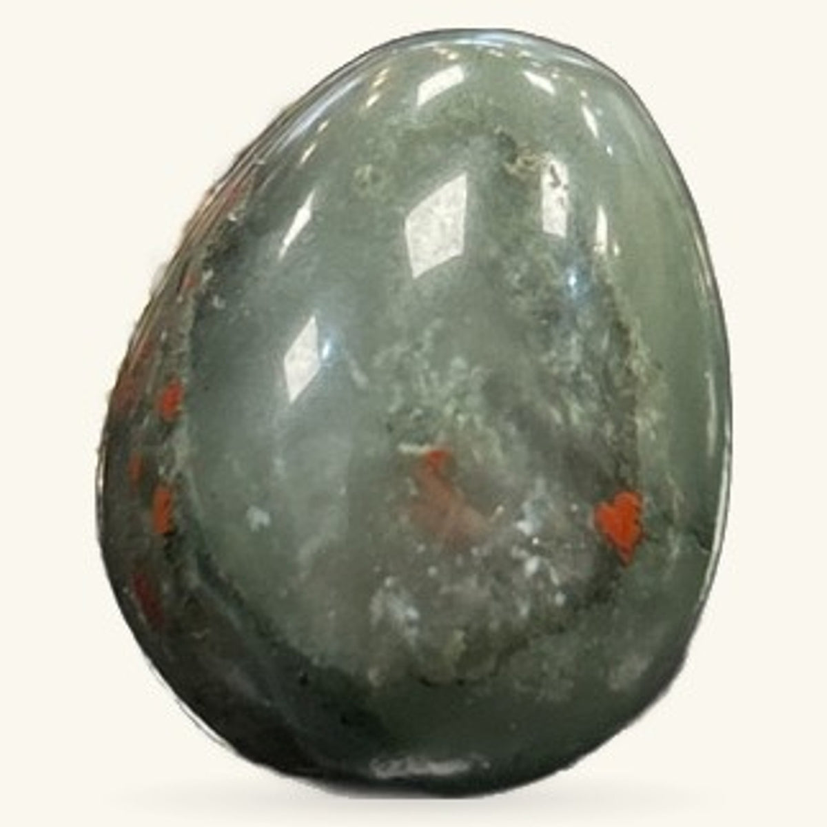 Polished bloodstone egg with red iron oxide inclusions on grey-green stone, smooth curved shape