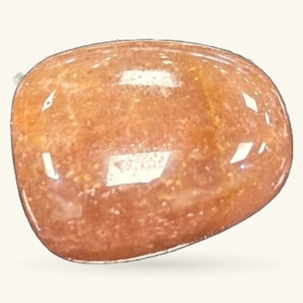 Polished strawberry quartz tumble stone with reddish-brown coloring and white inclusions