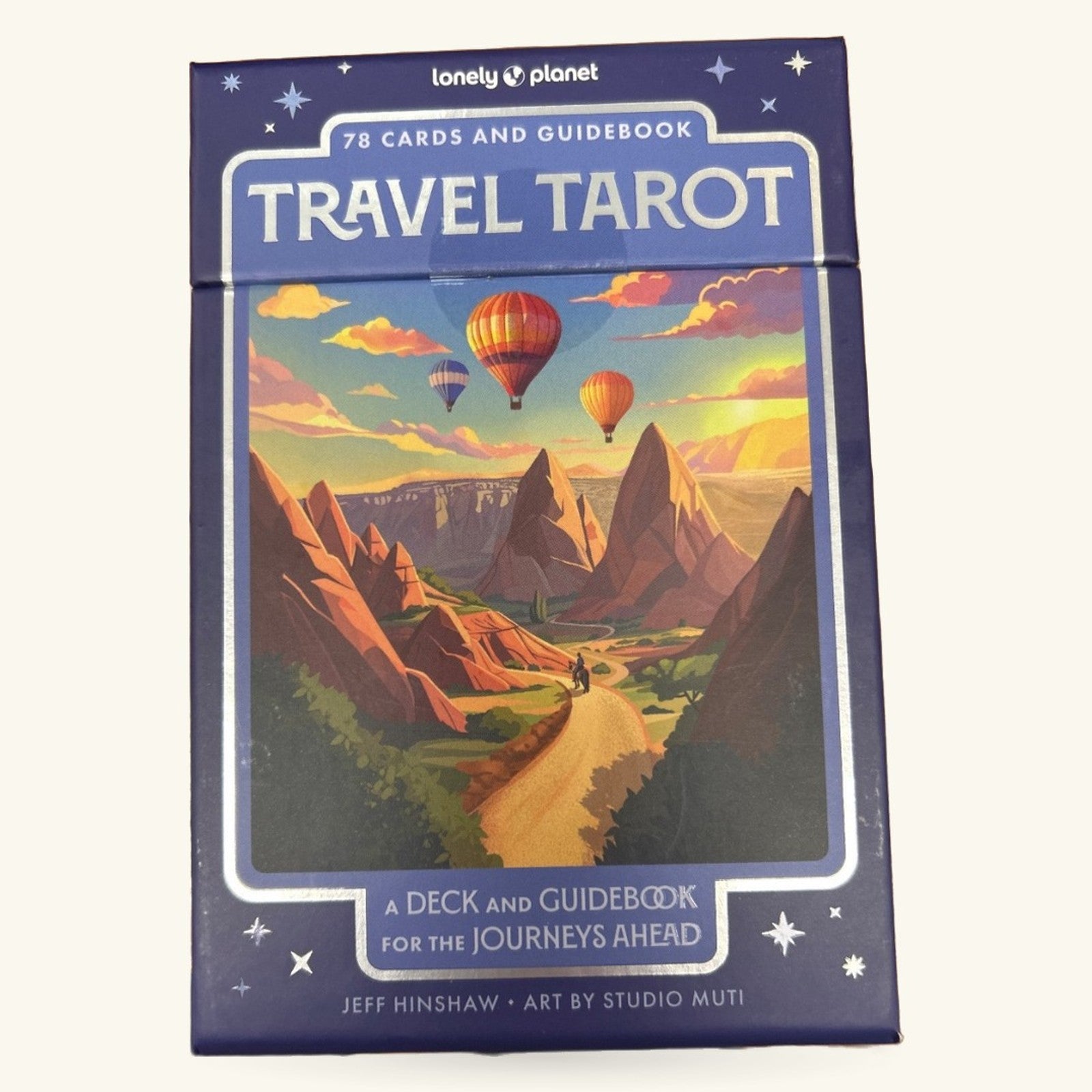 Lonely Planet Travel Tarot card deck box featuring hot air balloons over a desert canyon landscape at sunset