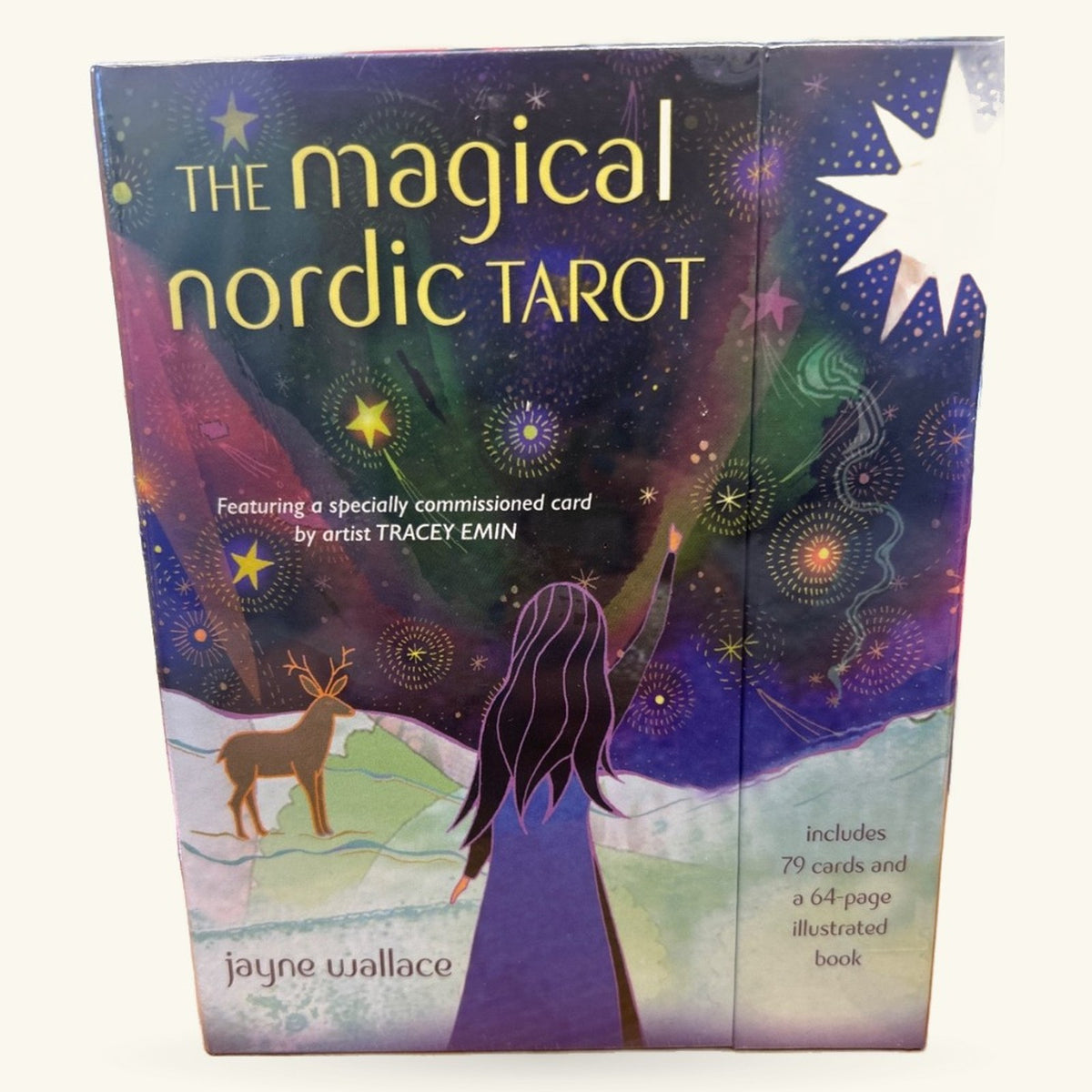 The Magical Nordic Tarot box by Jayne Wallace, featuring a woman gazing at a starry sky with a deer and snowy landscape below