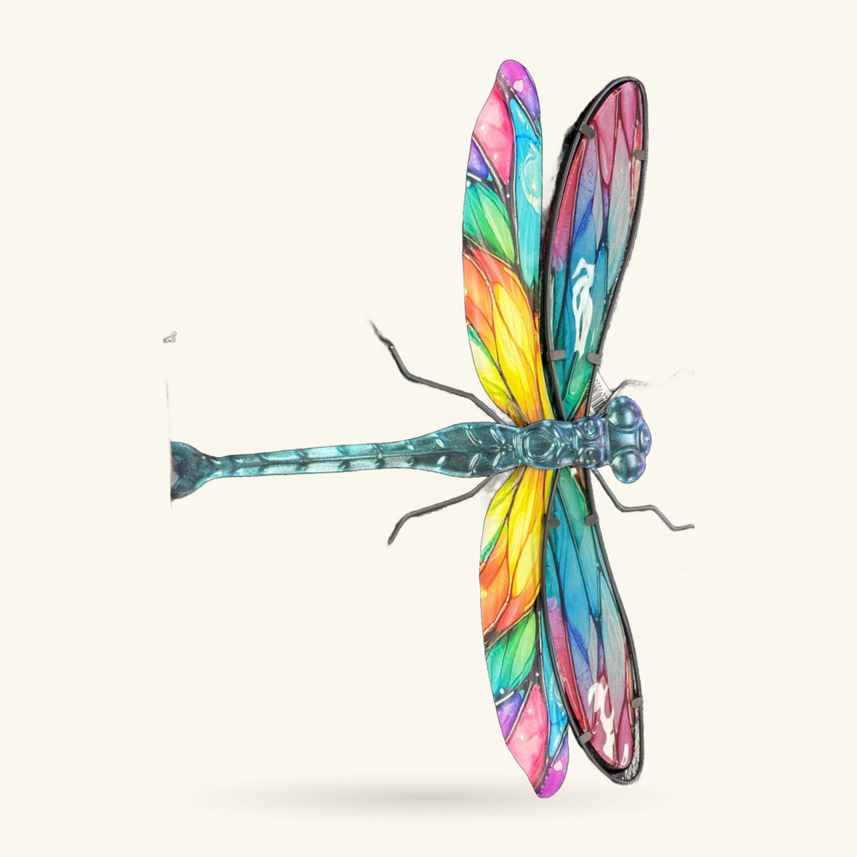Metal dragonfly wall art with rainbow-coloured wings in pink, purple, blue, green, yellow and orange
