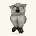 Grey ceramic garden owl figurine with reflective circular eyes and dark talons, 22cm tall.