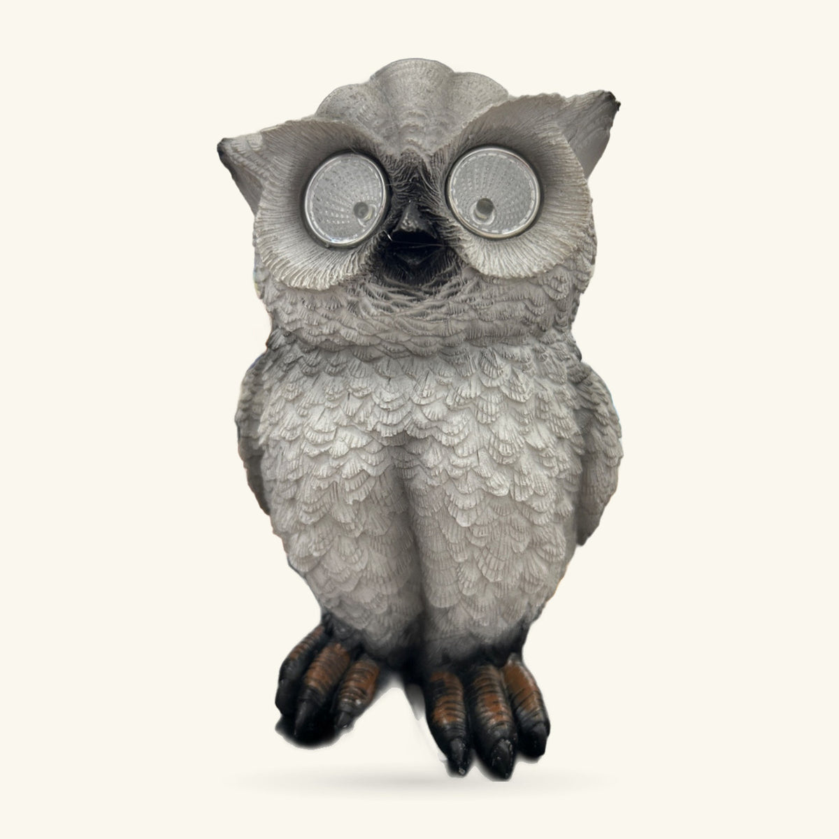 Grey ceramic garden owl figurine with reflective circular eyes and dark talons, 22cm tall.
