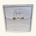Silver and gold beaded bracelet with three heart charms, on a Life Charms card printed 'Auntie'