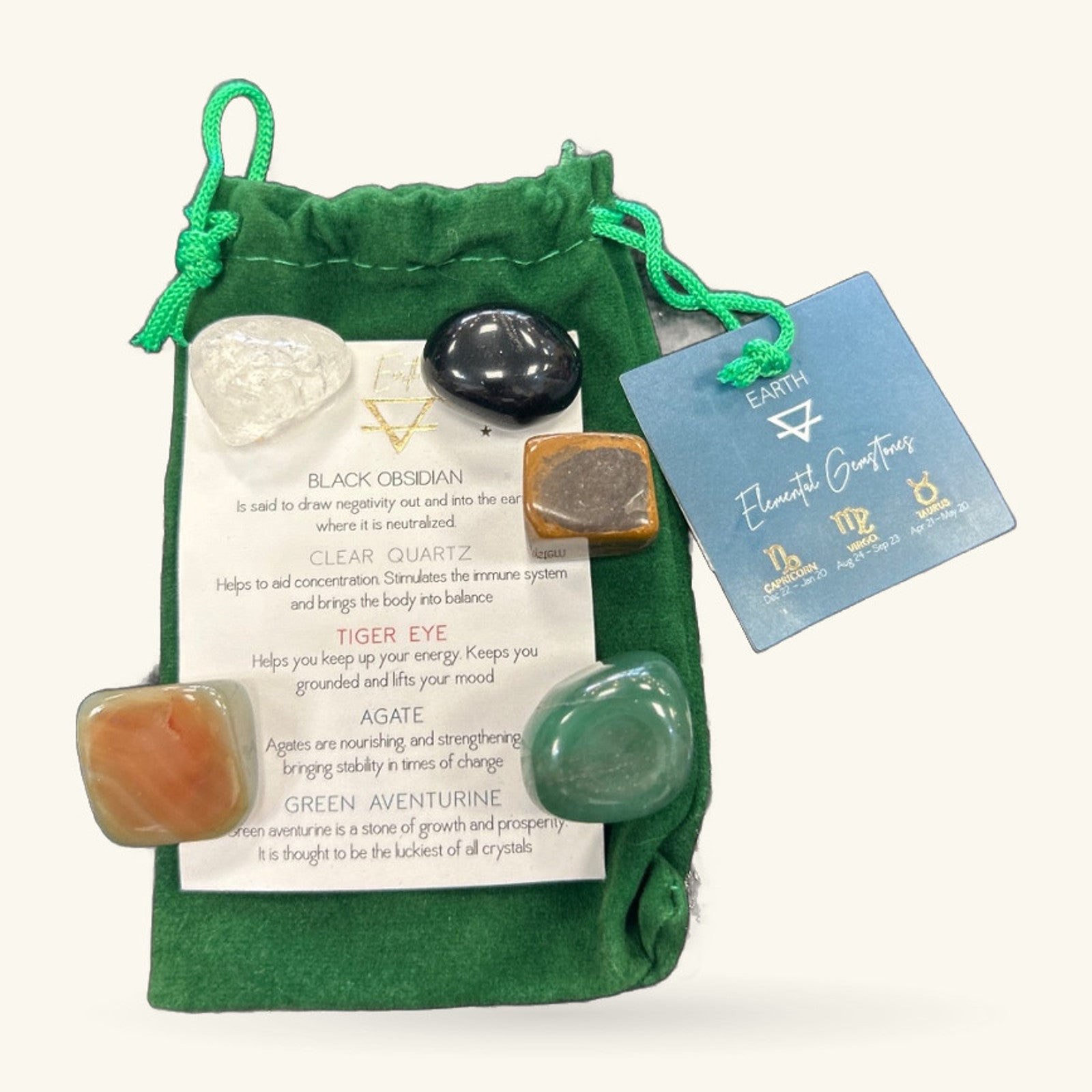 Green drawstring pouch with five polished stones and an information card labelled 'Earth Element Overseer'