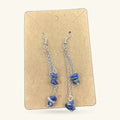 Pair of lapis lazuli dangle earrings on kraft card, with silver-tone chain and hooks