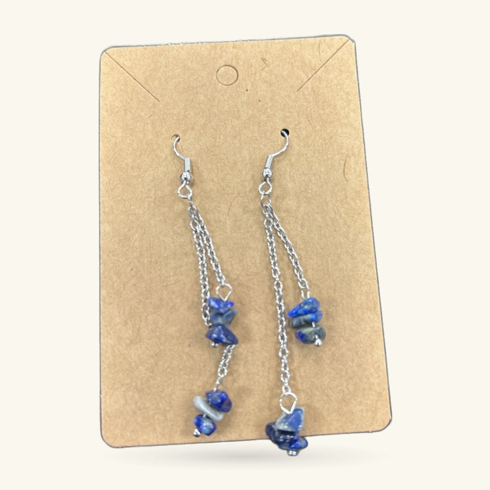 Pair of lapis lazuli dangle earrings on kraft card, with silver-tone chain and hooks