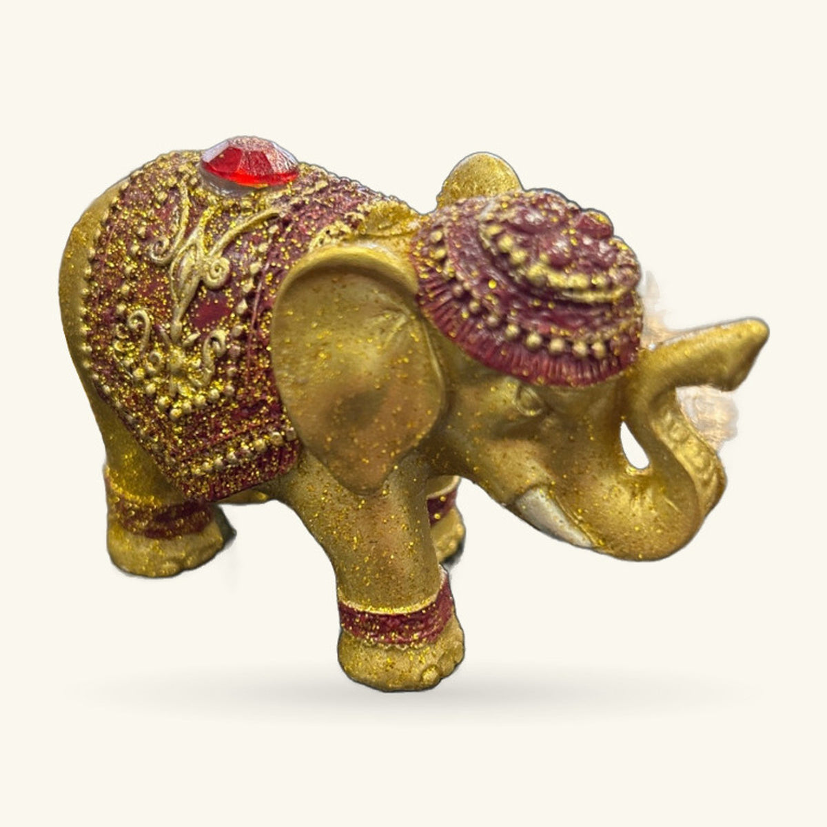 Gold metallic elephant incense holder with burgundy glitter details, red gem on head, standing pose