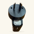 Grey and black USB power adapter with two flat prongs and a micro-USB connector port