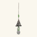 Black metal Christmas tree charm with green beads and faceted crystal ball suncatcher on silver chain