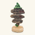 Stacked wooden signpost ornament with three carved arms reading Snail Trail, Fairy Ring, and Troll Bridge, topped with a green leaf finial