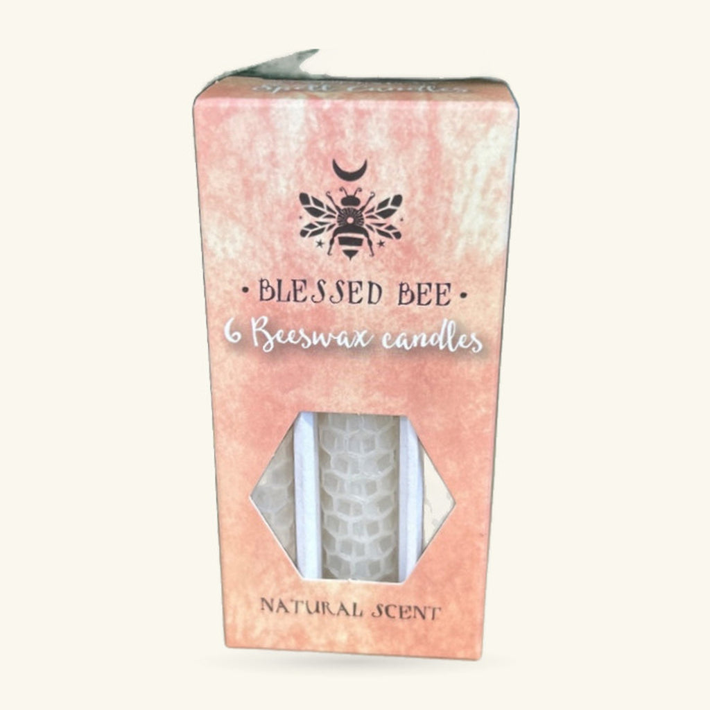 Pack of 6 white beeswax candles in a pink cardboard box with bee motif and natural scent labeling