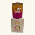Hippy Soul Pomegranate and Fig candle in gradient gold-to-plum vessel with cork lid, shown with its cream box below.