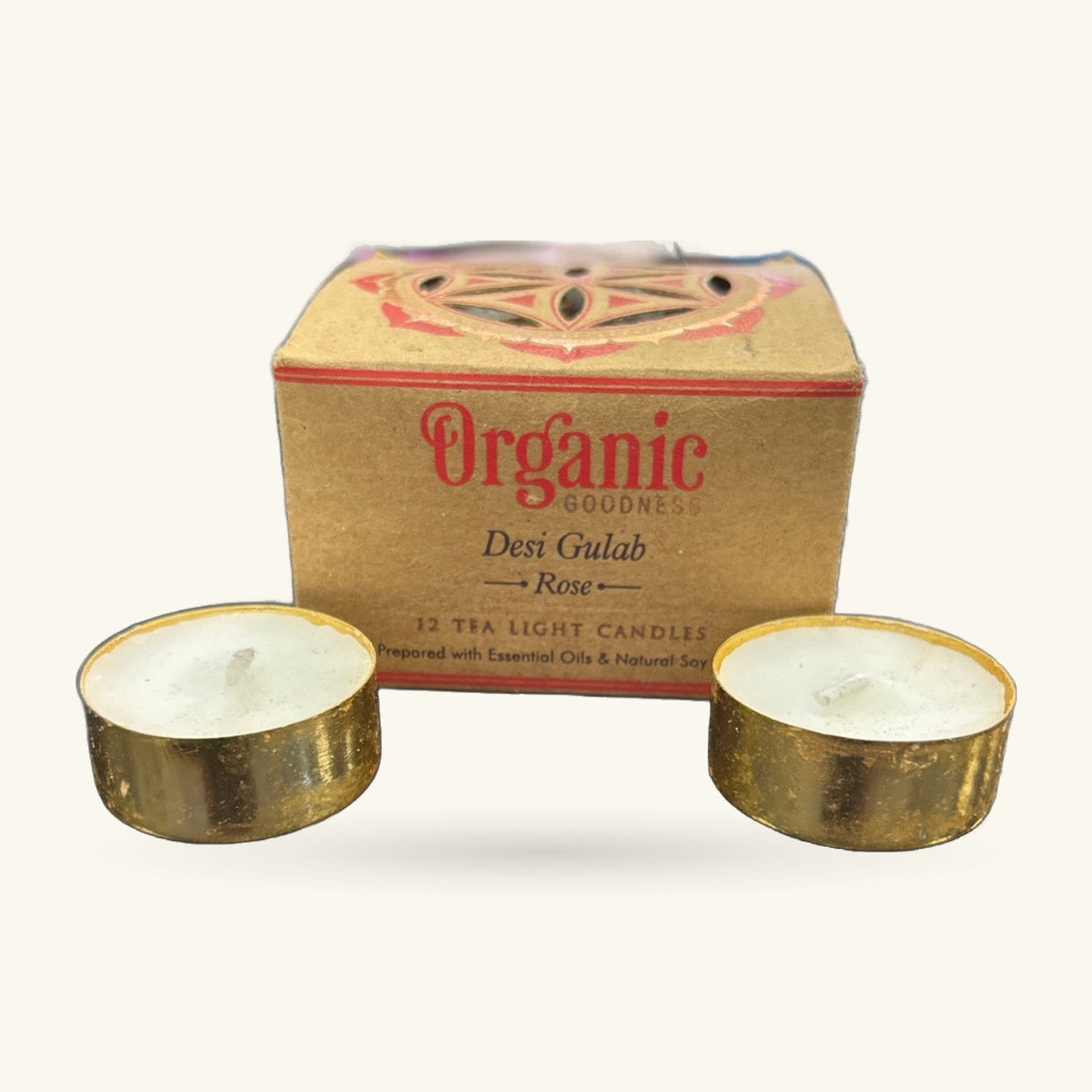 Organic Goodness Rose Tealight 12-pack box with decorative lid and two gold-wrapped tealight candles displayed in front