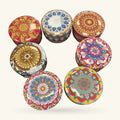 Six round decorative tins with mandala designs in gold, blue, red, and cream colours