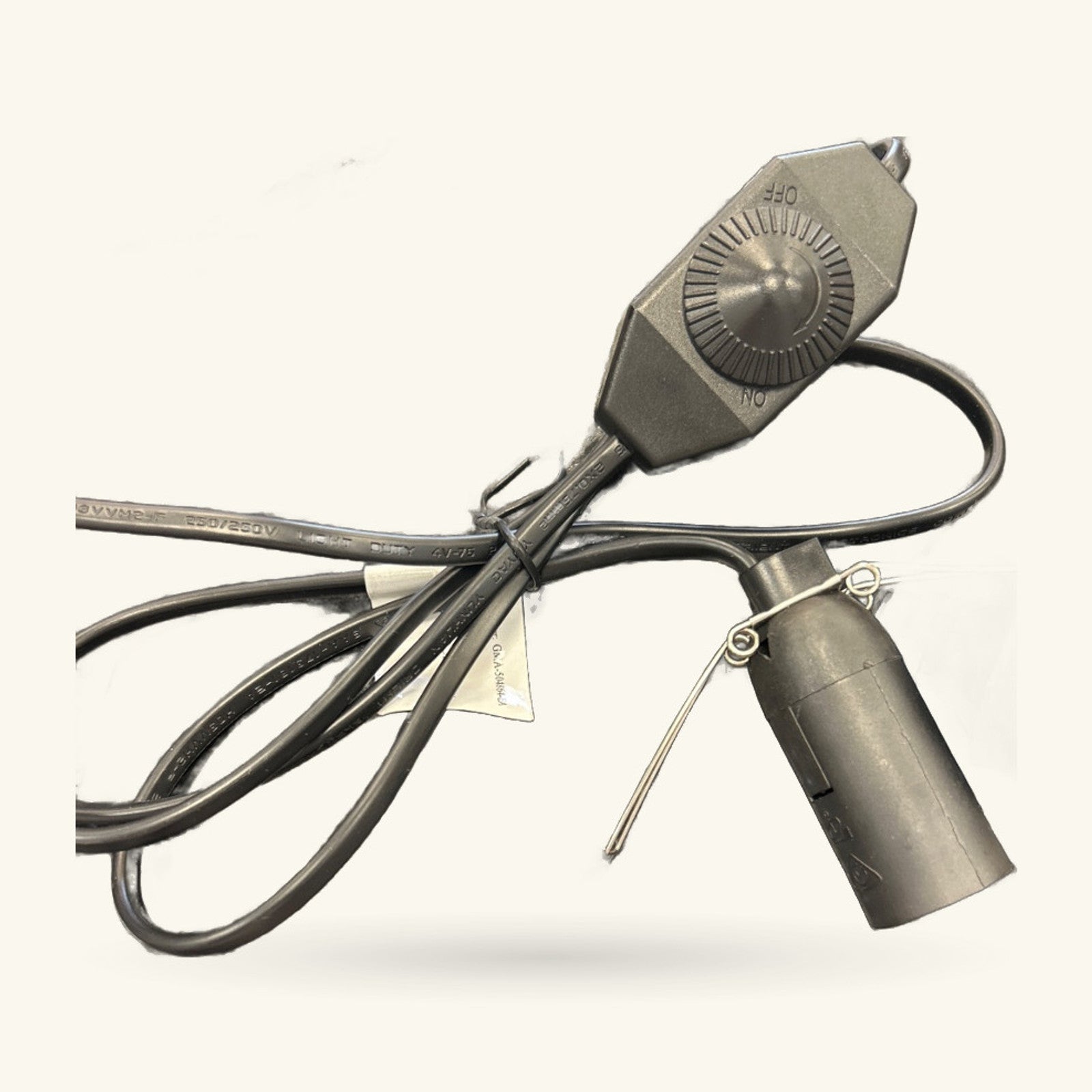 Salt lamp dimmer lead with rotary control head, fabric-covered cord, and threaded lamp socket.
