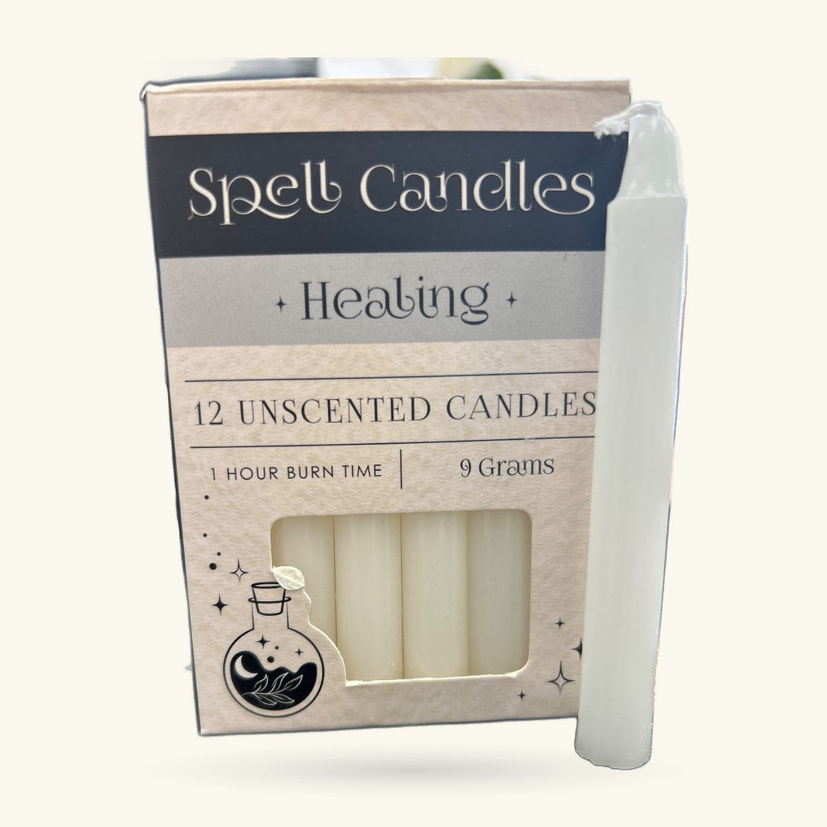 Box of 12 white unscented spell candles labeled Healing, with one white candle displayed beside it