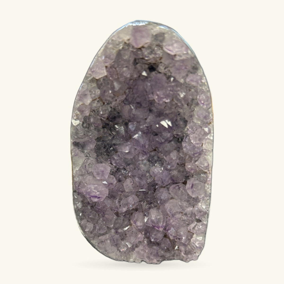 Amethyst cave geode, 243g, pale purple crystals lining hollow interior, polished rounded form