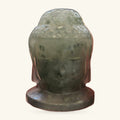 Labradorite Buddha head sculpture on a dark base, showing mottled green-grey stone with polished finish