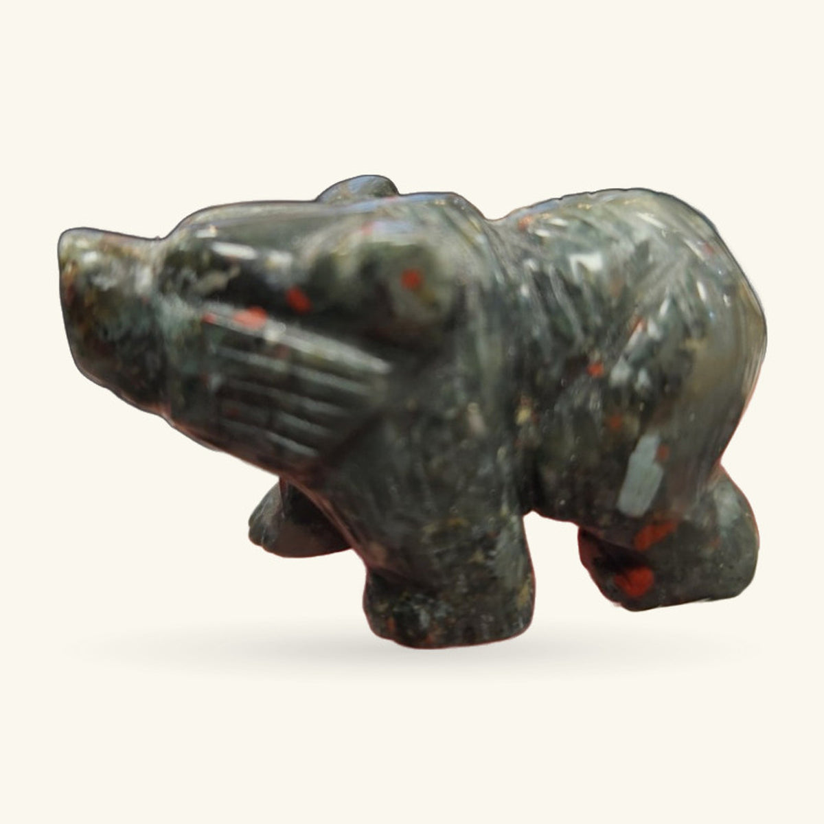 Bloodstone bear carving, dark green stone with red flecks, sitting upright on hind legs