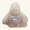 Pale agate Buddha figurine, seated with serene expression, polished finish