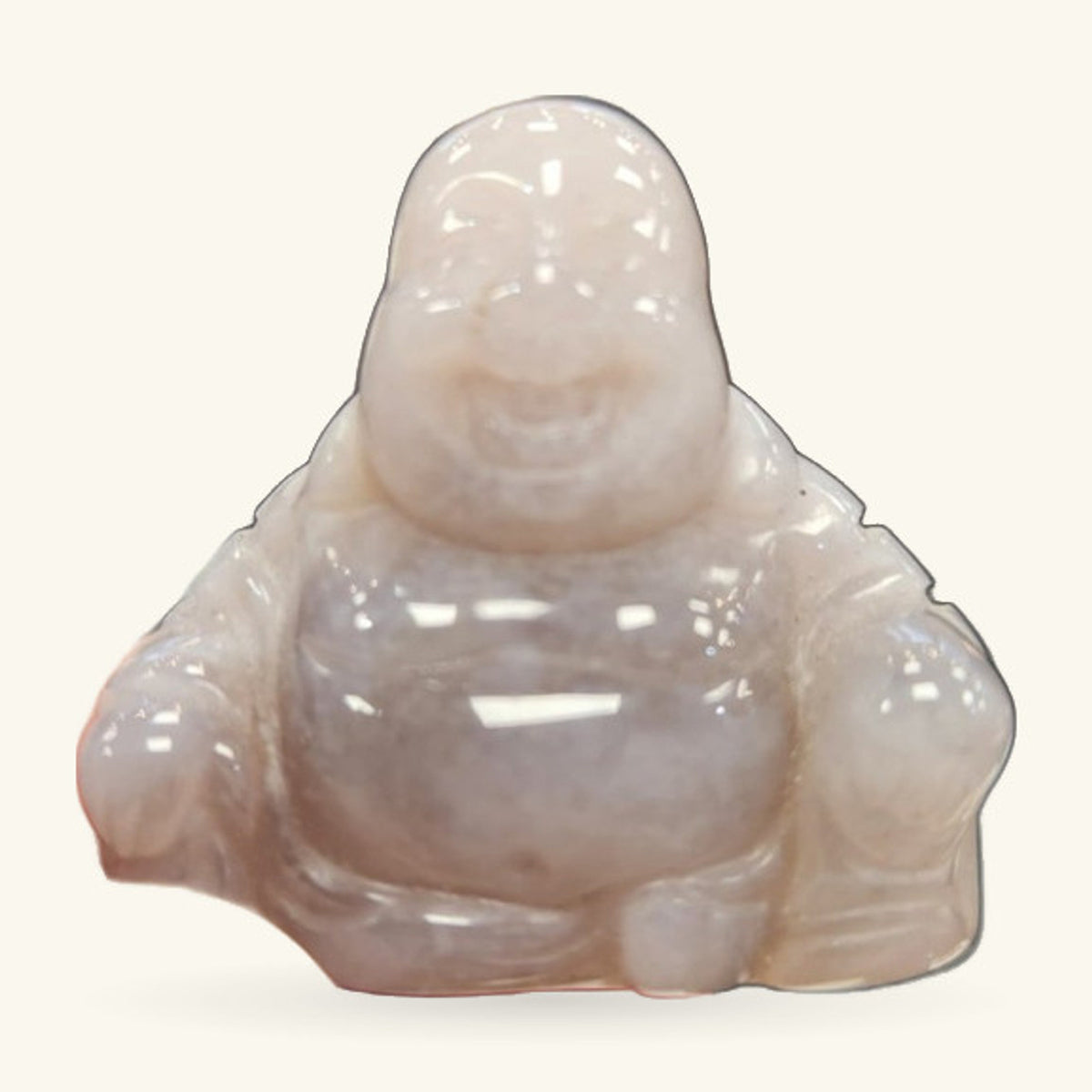 Pale agate Buddha figurine, seated with serene expression, polished finish