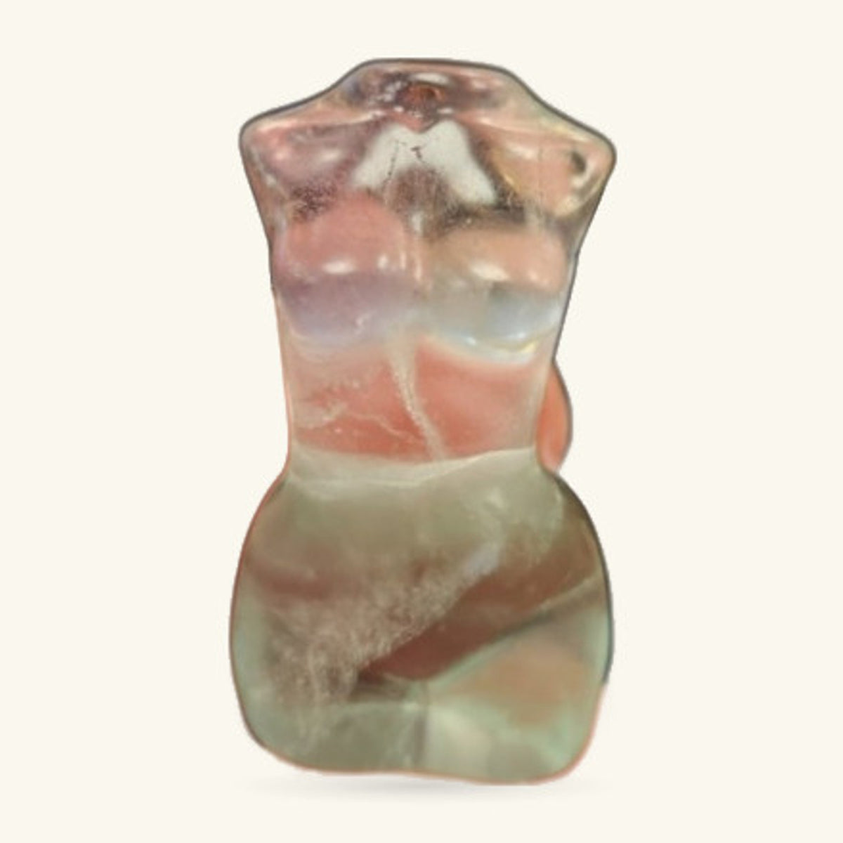 Fluorite body carving showing natural colour layering in cream, peach, and grey tones