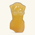 Orange calcite body carving, hand-sized, smooth polished finish with natural translucence at the top.
