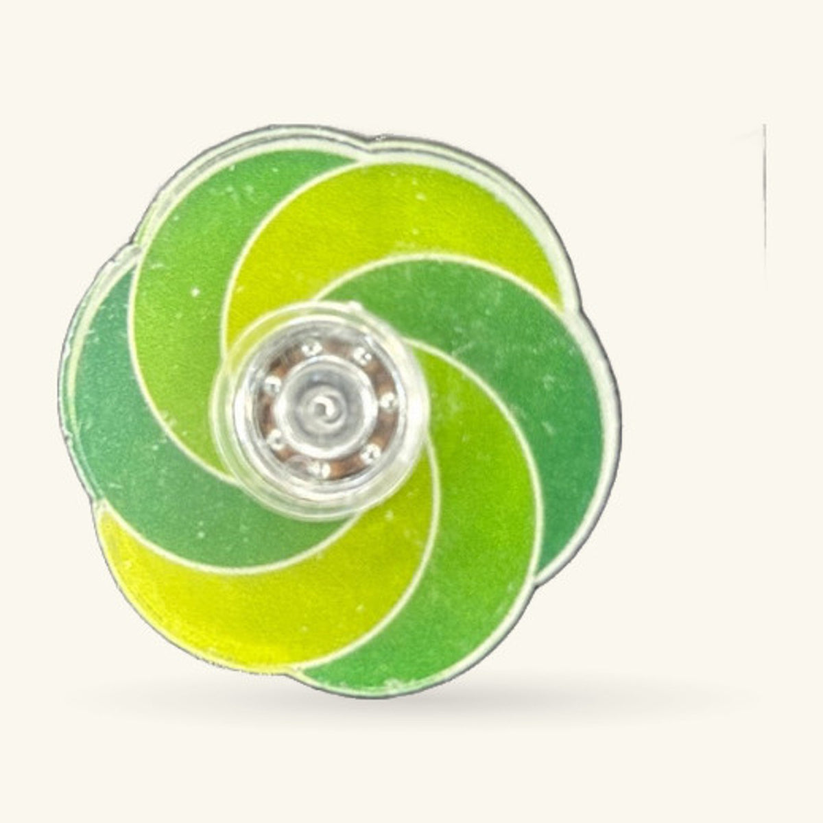 Green spiral fidget spinner with lime and forest green sections and clear acrylic center.