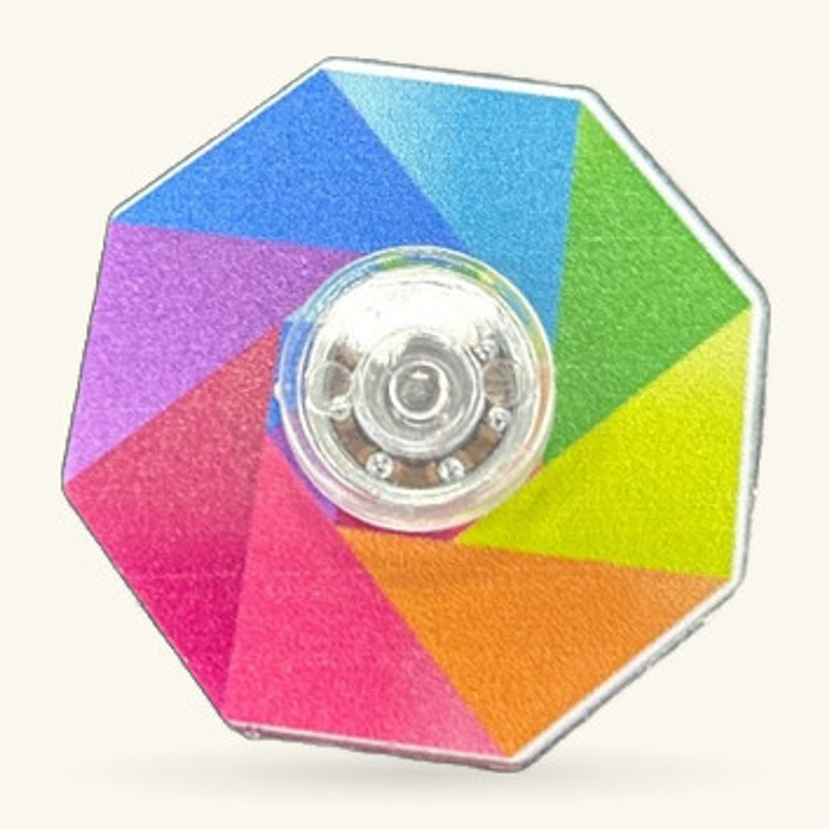 Rainbow hexagon fidget spinner with six coloured sections and silver centre mechanism
