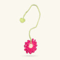 Crochet flower bookmark with bright pink daisy, cream centre, green stem and small heart charm