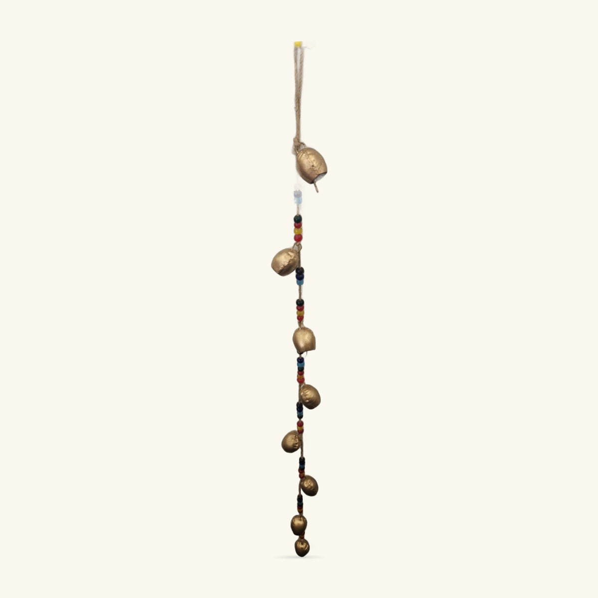 Gold-coloured iron bells with coloured glass beads on twine, hanging vertically