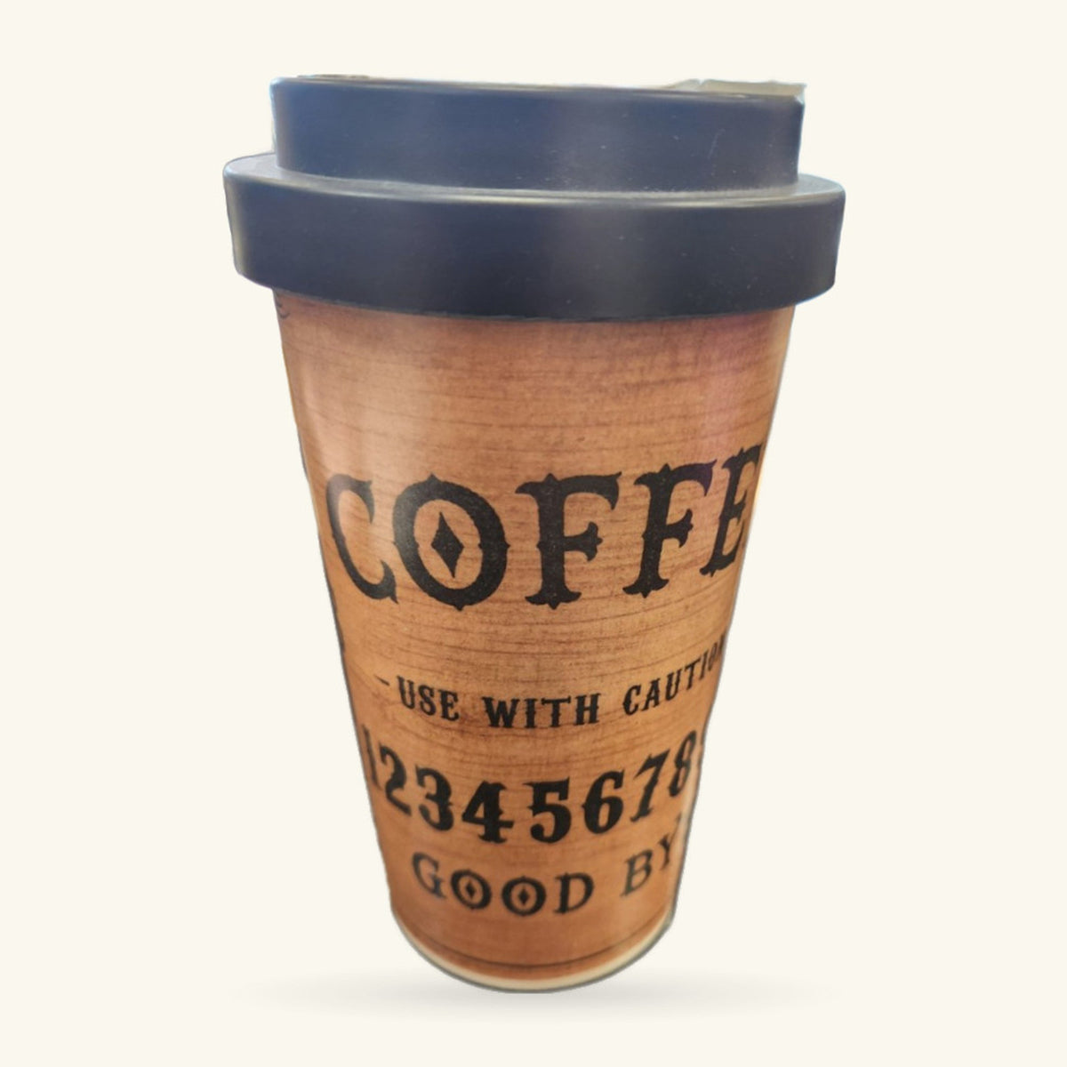 Travel mug with cork wrap printed 'COFFEE', black silicone lid, on white background