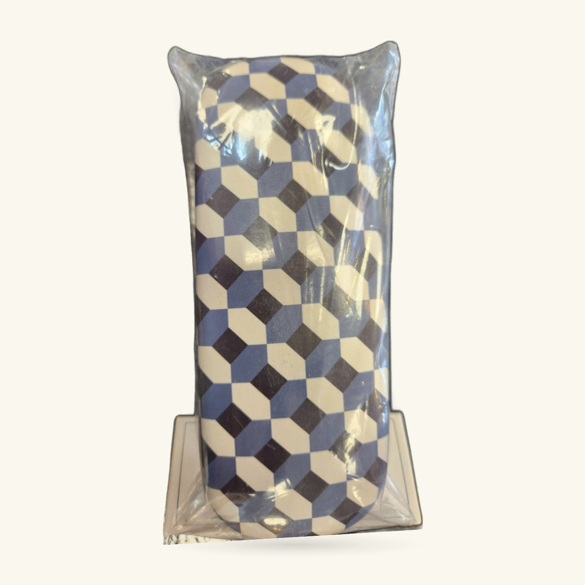 Blue, cream and black geometric cube pattern glasses case in clear packaging
